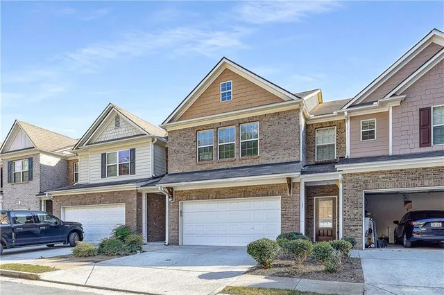 a view of a house with a street