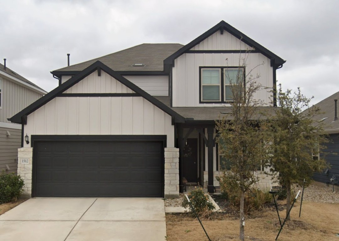1512 Hope Ranch Road Leander, TX 78641 - Photo 1 of 1 Modern farmhouse style home featuring board and batten siding, driveway, a garage, and stone siding