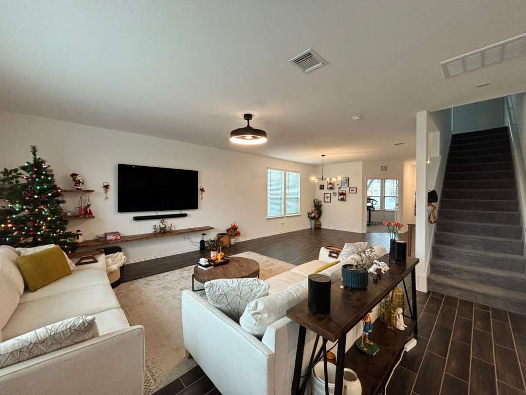 1512 Hope Ranch Road Leander, TX 78641 - Photo 11 of 27 a living room with furniture and a flat screen tv