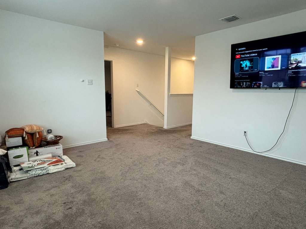 1512 Hope Ranch Road Leander, TX 78641 - Photo 15 of 27 a view of a livingroom with an empty space and a fireplace