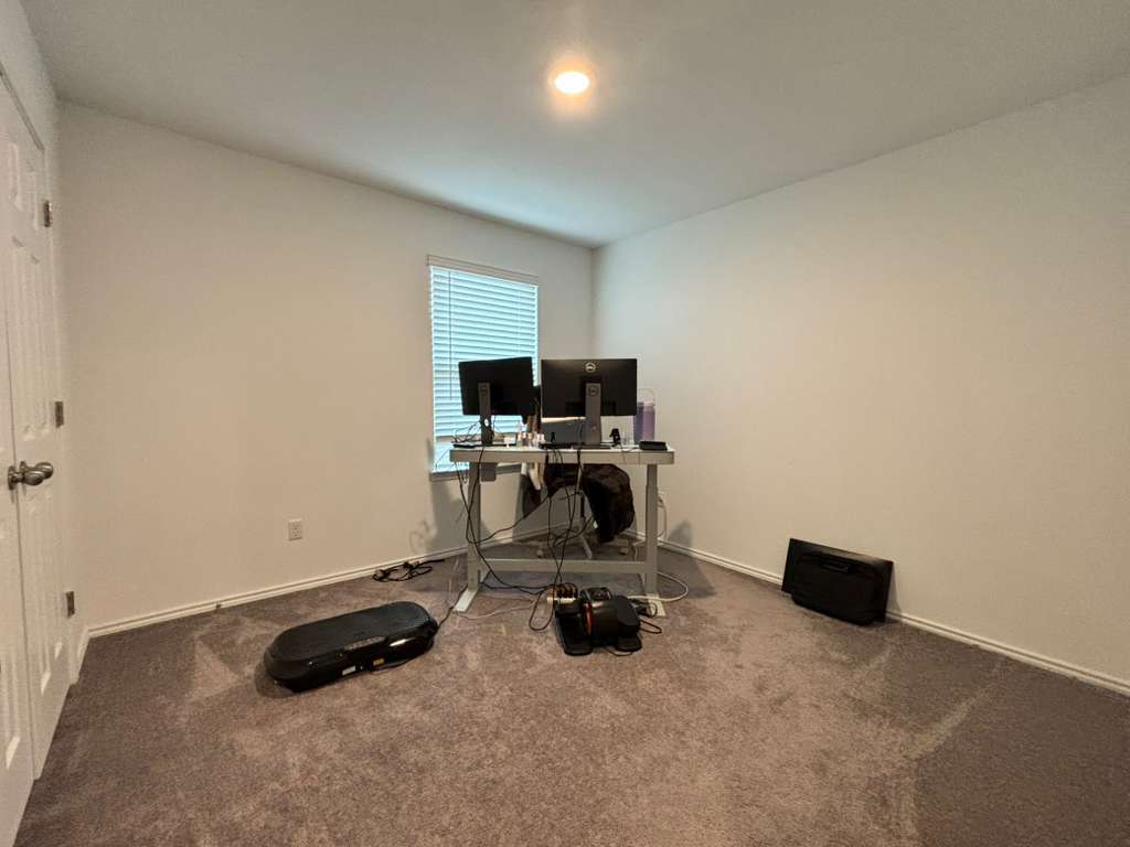 1512 Hope Ranch Road Leander, TX 78641 - Photo 19 of 27 a room with furniture and gym equipment