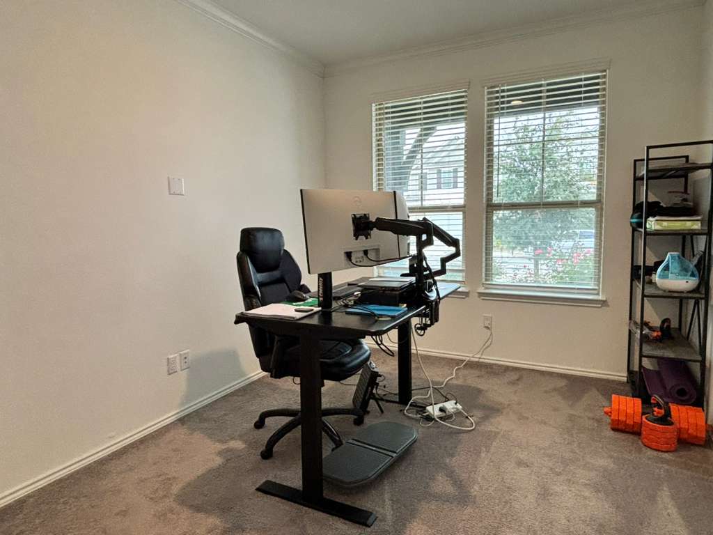 1512 Hope Ranch Road Leander, TX 78641 - Photo 5 of 27 a view of a workspace with furniture and a window