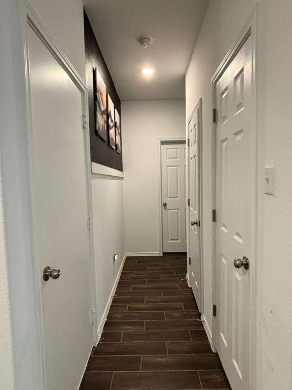 1512 Hope Ranch Road Leander, TX 78641 - Photo 6 of 27 a view of a hallway with wooden floor and staircase