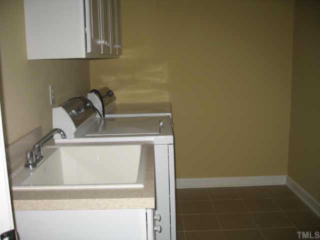 2924 Elmfield Street Raleigh, NC 27614 - Photo 8 of 10 Sceond floor utility has a sink & a Maytag washer & dryer that convey.