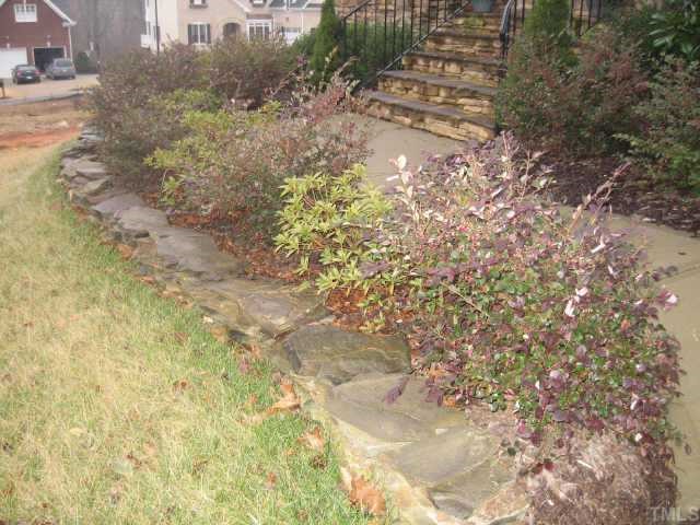 2924 Elmfield Street Raleigh, NC 27614 - Photo 10 of 10 Enjoy the pretty stacked stone planters as you enter your new home!