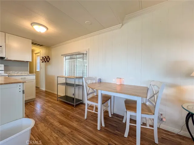 a kitchen with cabinets appliances a sink and a window
