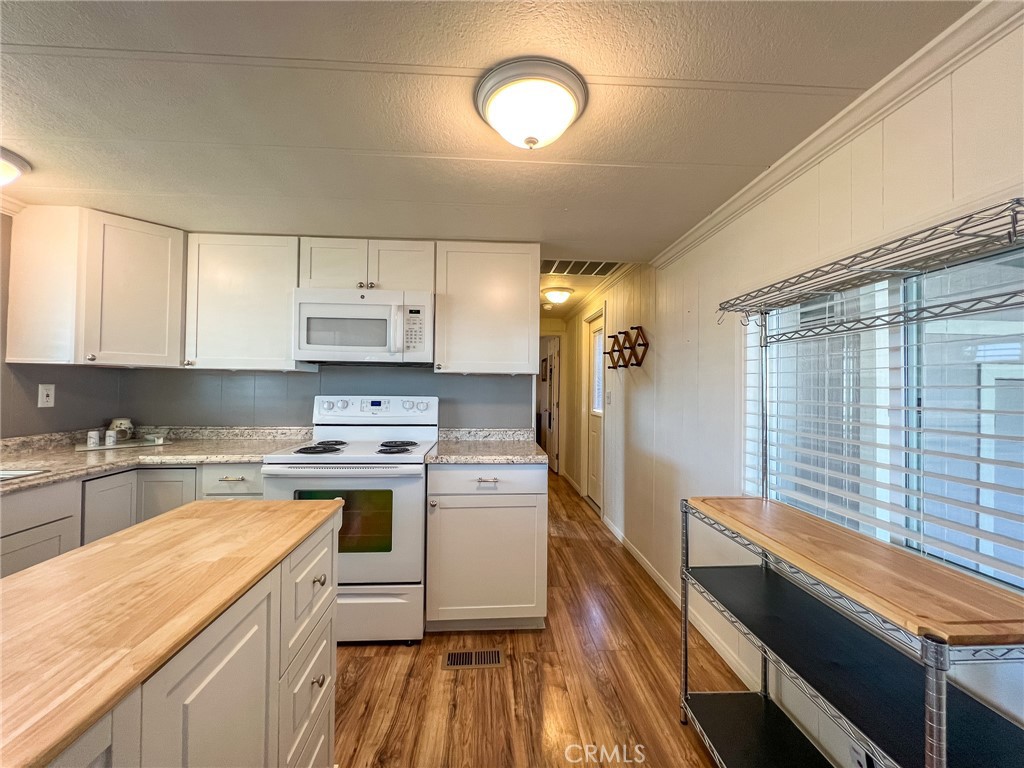 650 Channel Way, Unit 650 Needles, CA 92363 - Photo 18 of 60 a kitchen with cabinets a sink and appliances