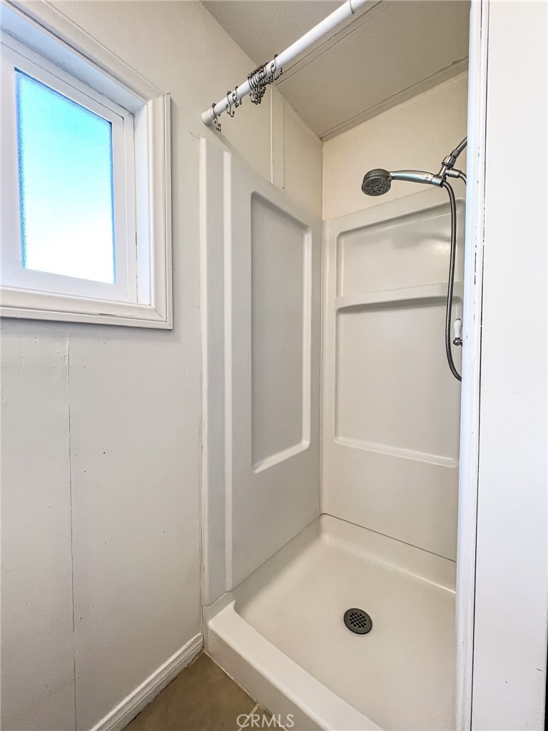 650 Channel Way, Unit 650 Needles, CA 92363 - Photo 28 of 60 a bathroom with a glass shower door
