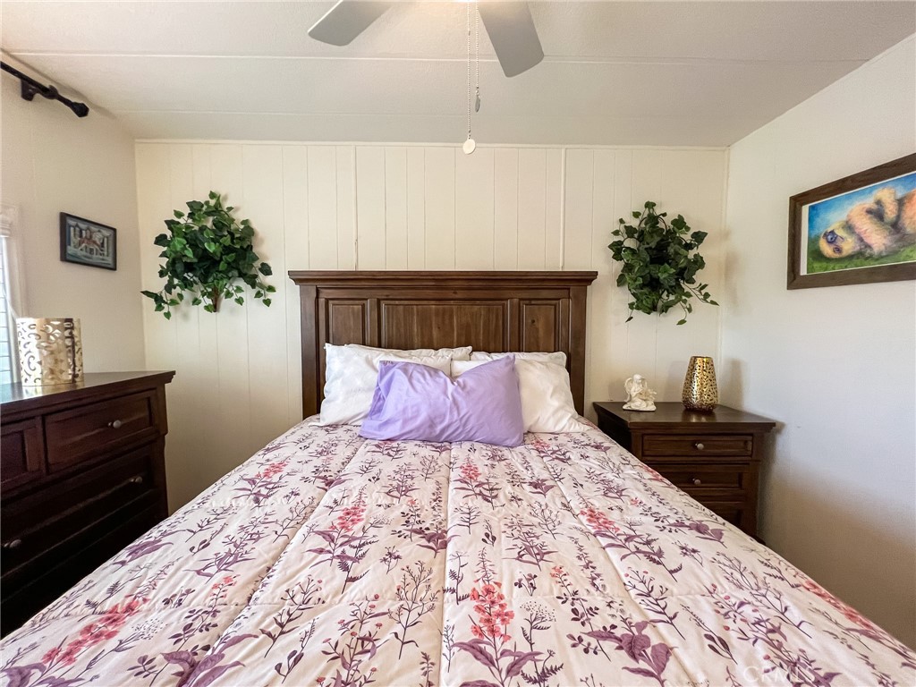 650 Channel Way, Unit 650 Needles, CA 92363 - Photo 30 of 60 a bedroom with a bed and a potted plant on dresser