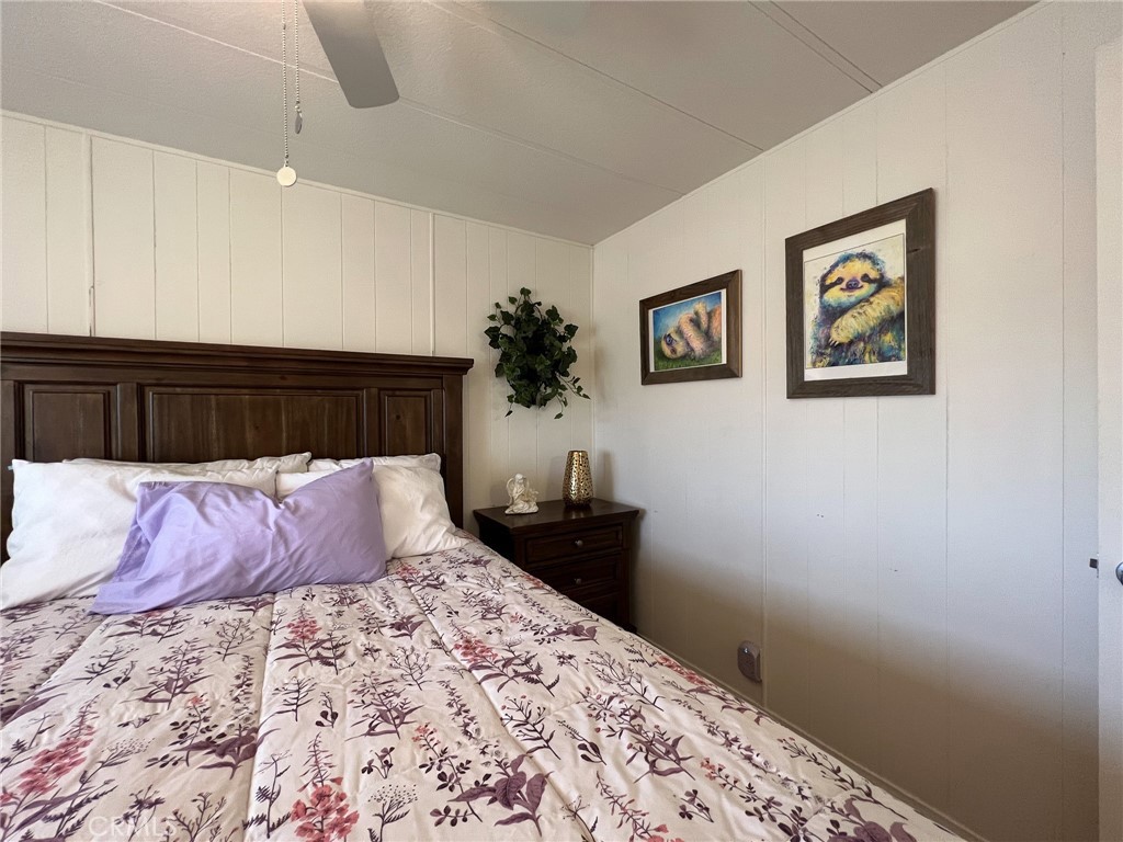 650 Channel Way, Unit 650 Needles, CA 92363 - Photo 31 of 60 a bedroom with a bed and a lamp on dresser