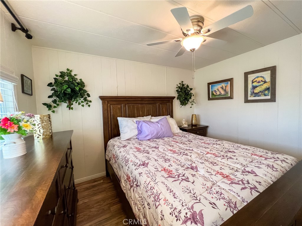 650 Channel Way, Unit 650 Needles, CA 92363 - Photo 33 of 60 a bedroom with a large bed and a chandelier