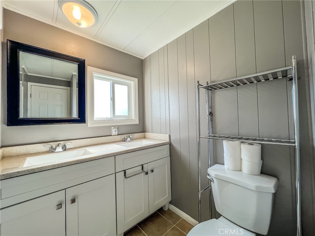 650 Channel Way, Unit 650 Needles, CA 92363 - Photo 38 of 60 a bathroom with a toilet sink and mirror