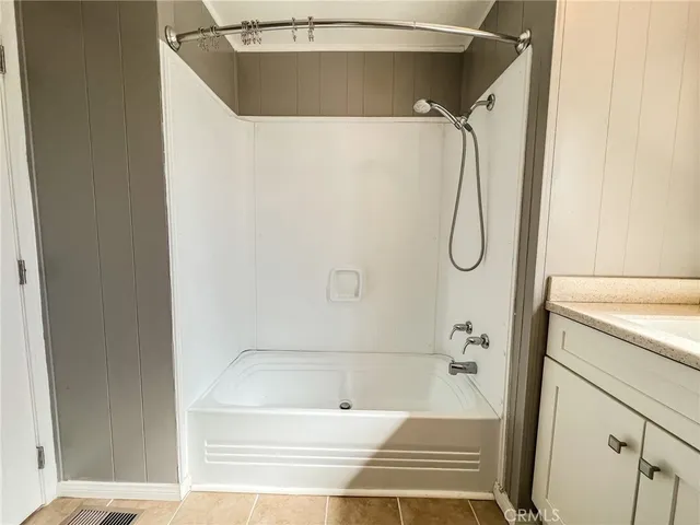 a view of a chair and tables front of the house