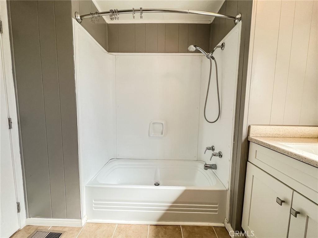 650 Channel Way, Unit 650 Needles, CA 92363 - Photo 40 of 60 a bathroom with a bathtub and a shower