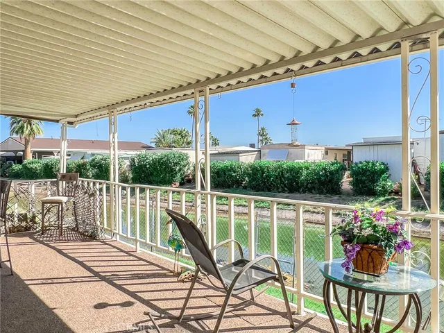 a view of swimming pool with outdoor seating and yard