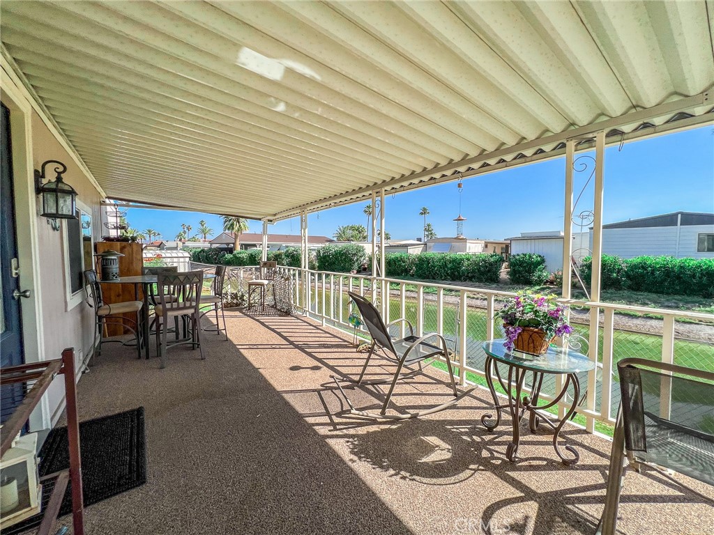 650 Channel Way, Unit 650 Needles, CA 92363 - Photo 44 of 60 a view of a patio with a table chairs and a patio