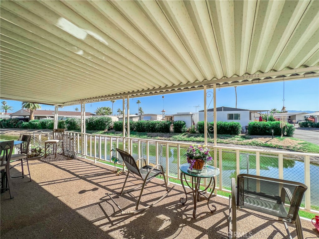 650 Channel Way, Unit 650 Needles, CA 92363 - Photo 45 of 60 a view of a patio with a table chairs and a patio