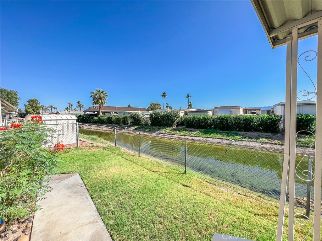 650 Channel Way, Unit 650 Needles, CA 92363 - Photo 48 of 60 a view of a swimming pool with a yard