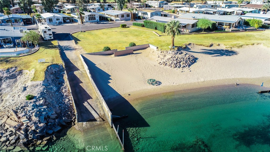 650 Channel Way, Unit 650 Needles, CA 92363 - Photo 58 of 60 a view of a swimming pool with outdoor seating and lake view