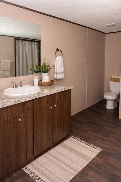 523 Welcome Hill Road Trion, GA 30753 - Photo 7 of 19 a bathroom with a sink and a mirror