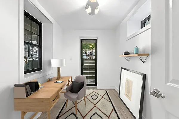a view of a livingroom with furniture and windows
