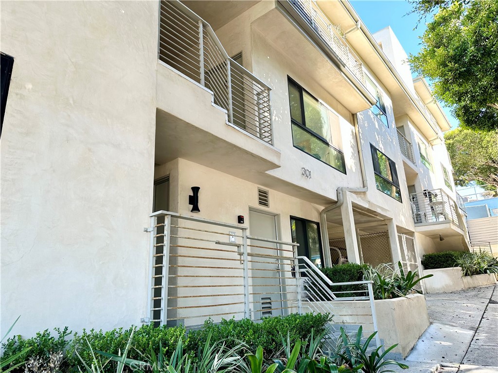 301 Ashland Avenue, Unit 4 Santa Monica, CA 90405 - Photo 1 of 24 a view of a building with a yard