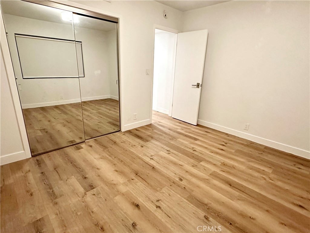 301 Ashland Avenue, Unit 4 Santa Monica, CA 90405 - Photo 17 of 24 an empty room with wooden floor