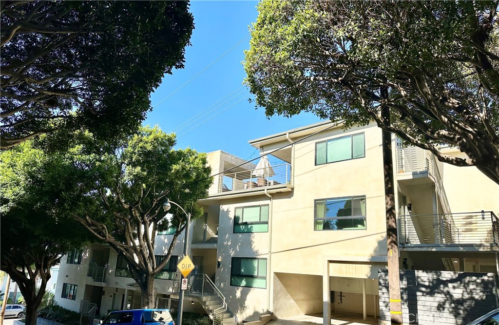 301 Ashland Avenue, Unit 4 Santa Monica, CA 90405 - Photo 2 of 24 a view of a white house with large trees