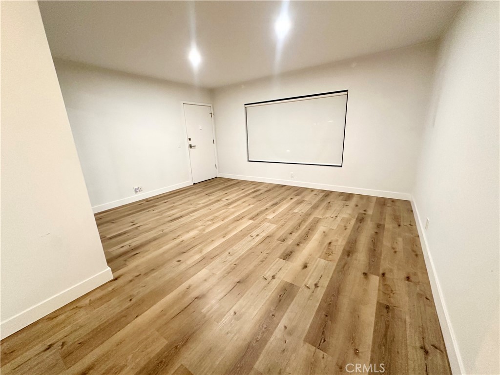 301 Ashland Avenue, Unit 4 Santa Monica, CA 90405 - Photo 3 of 24 an empty room with wooden floor and closet