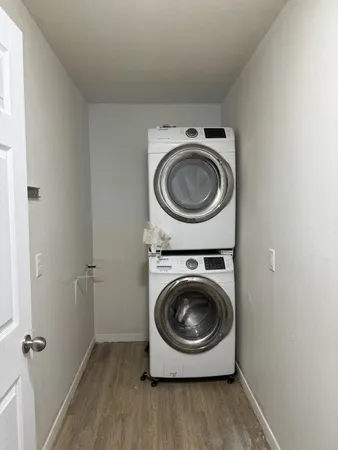 a utility room with sink dryer and washer