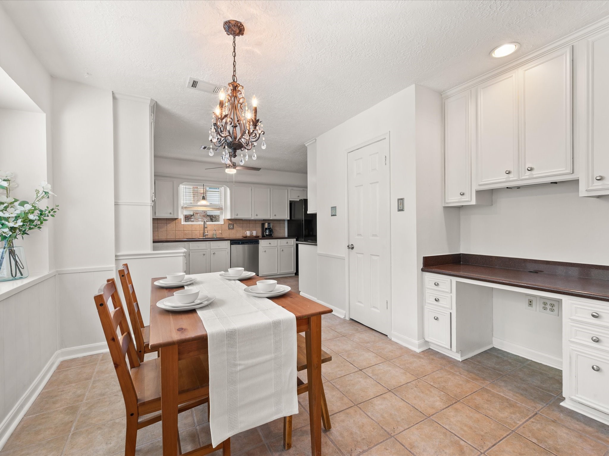 5223 Ashmere Lane Spring, TX 77379 - Photo 15 of 50 The kitchen offers both charm and function with a sunny breakfast room, built-in desk, custom hutch, and walk-in-pantry.