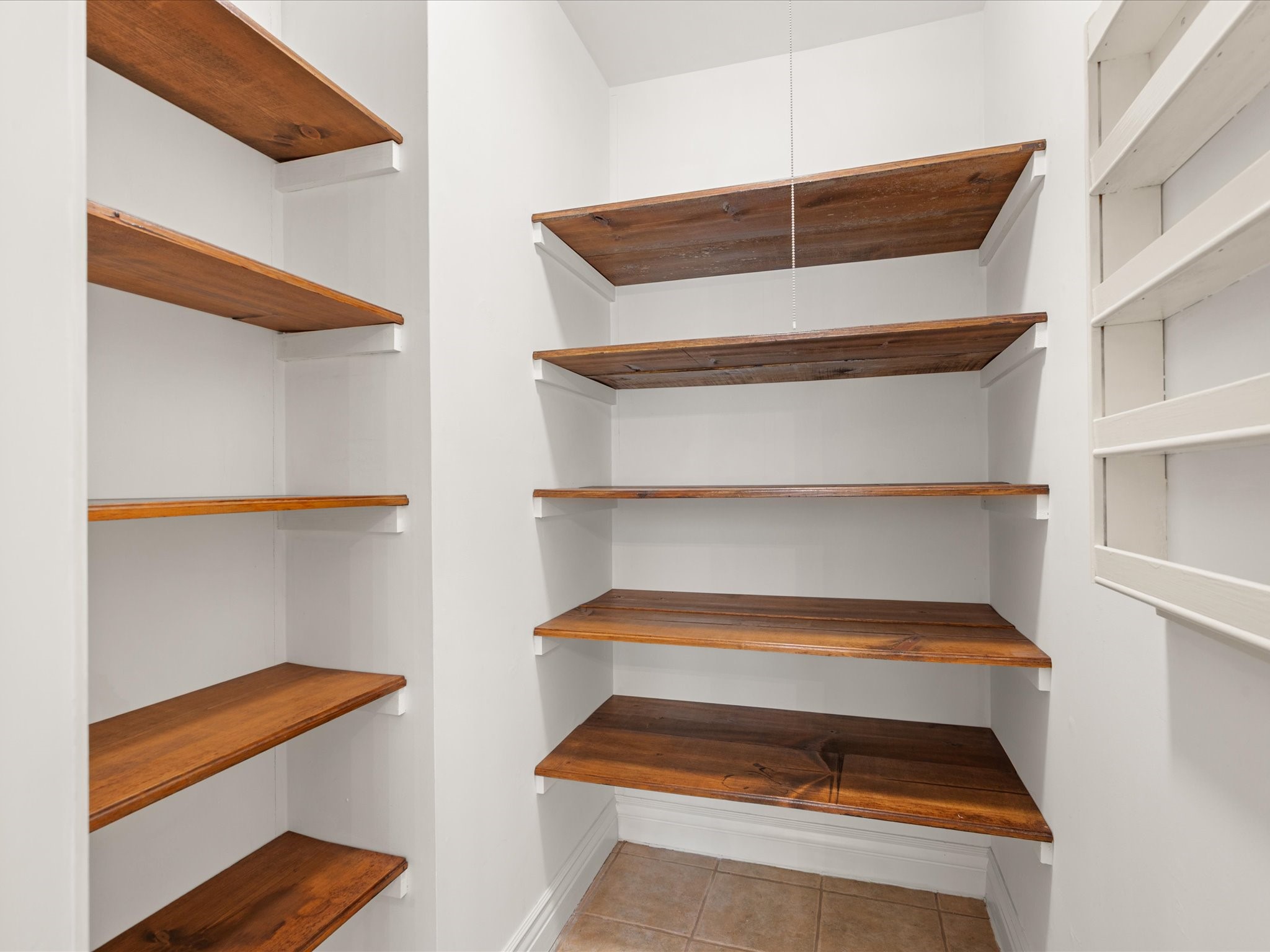 5223 Ashmere Lane Spring, TX 77379 - Photo 19 of 50 Generous storage in the walk-in pantry keeps everything organized and within reach.