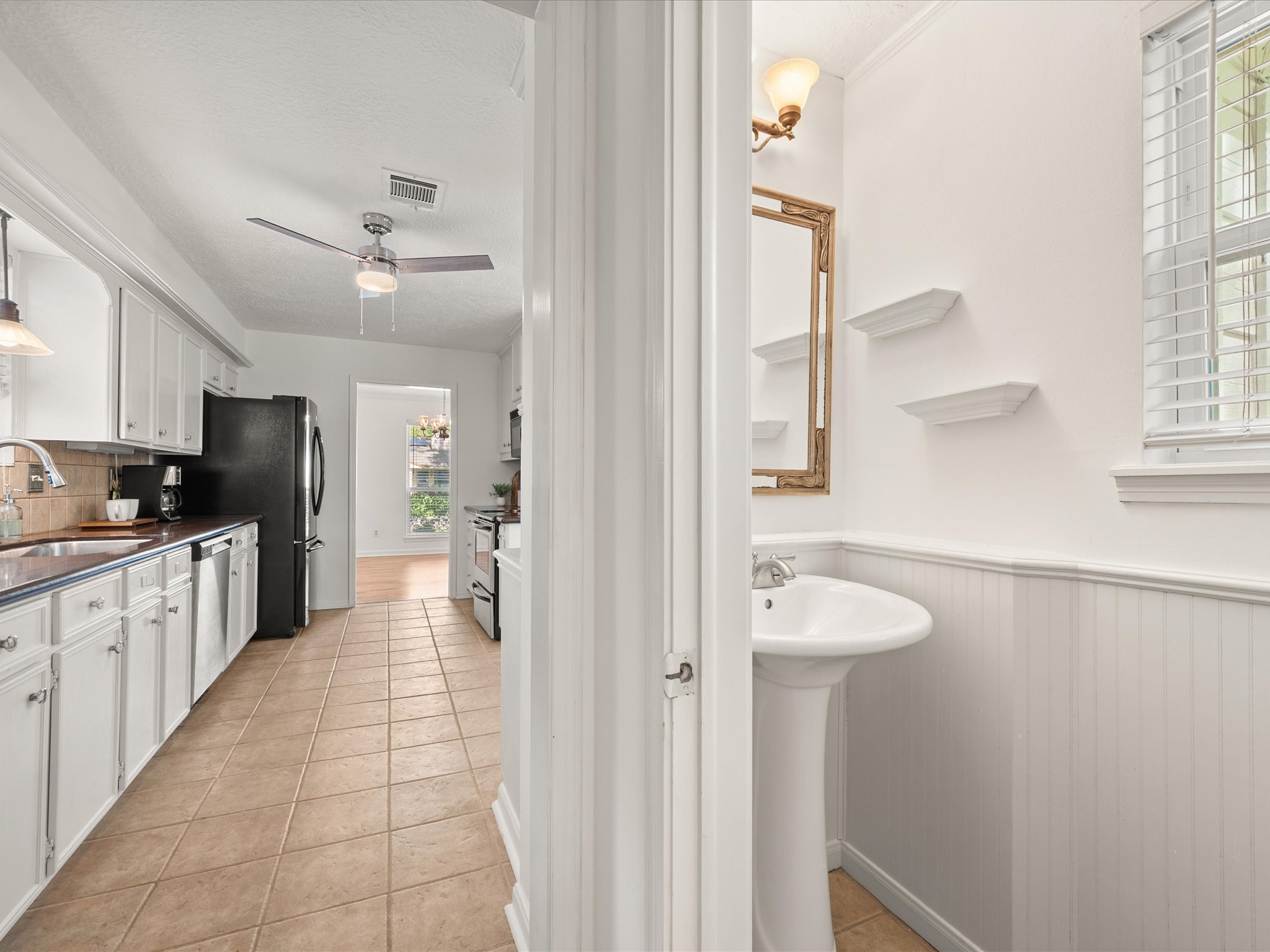 5223 Ashmere Lane Spring, TX 77379 - Photo 20 of 50 The half-bath is conveniently located for guests, just off the kitchen.