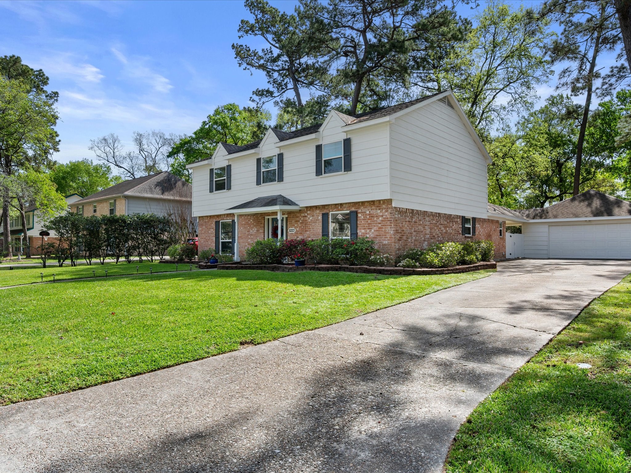 5223 Ashmere Lane Spring, TX 77379 - Photo 2 of 50 Spacious driveway with a detached garage—offering both function and flexibility.