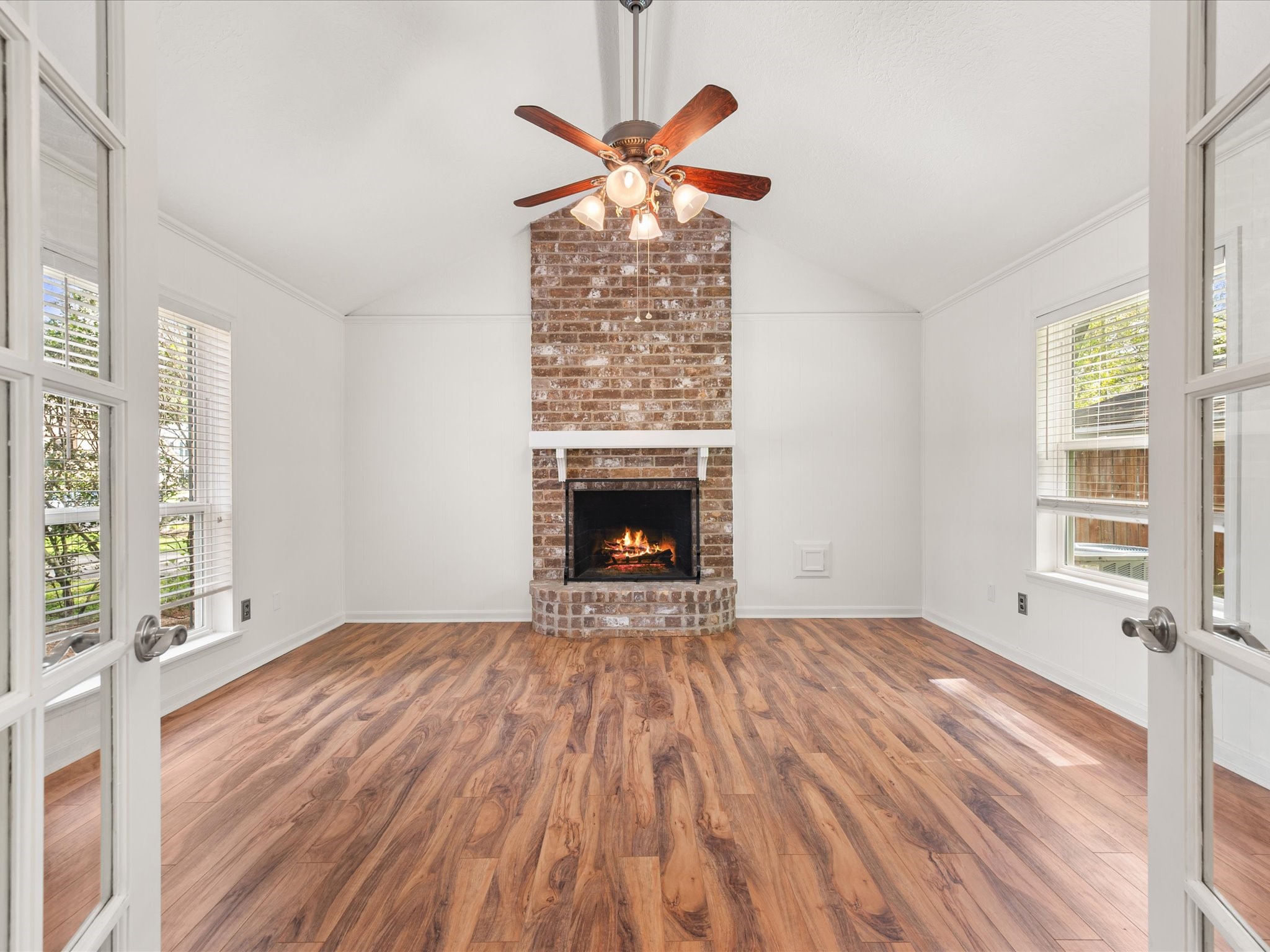 5223 Ashmere Lane Spring, TX 77379 - Photo 9 of 50 A floor-to-ceiling fireplace anchors this bonus room/flex space.