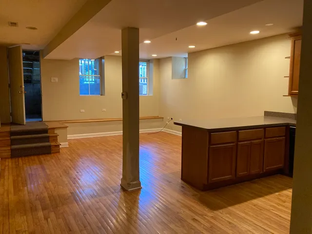 a view of a living room with wooden floor