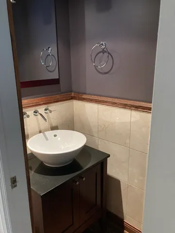 a bathroom with a sink a mirror and a shower