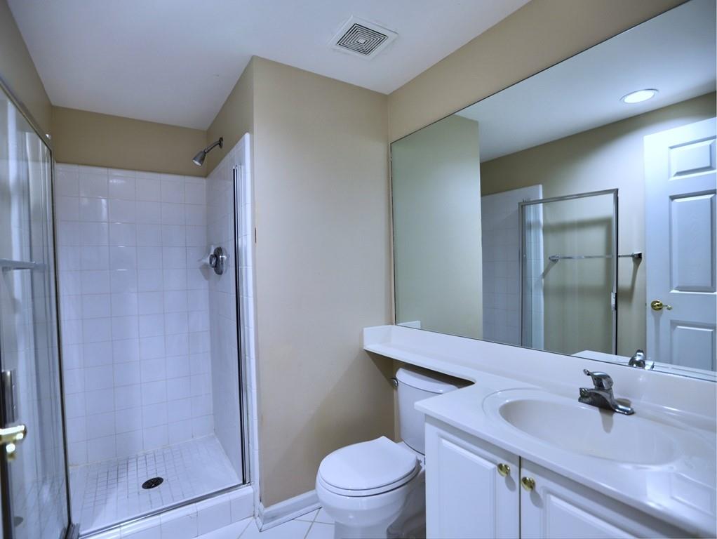 3636 Habersham Road Northwest, Unit 2308 Atlanta, GA 30305 - Photo 19 of 43 a bathroom with a sink toilet and shower