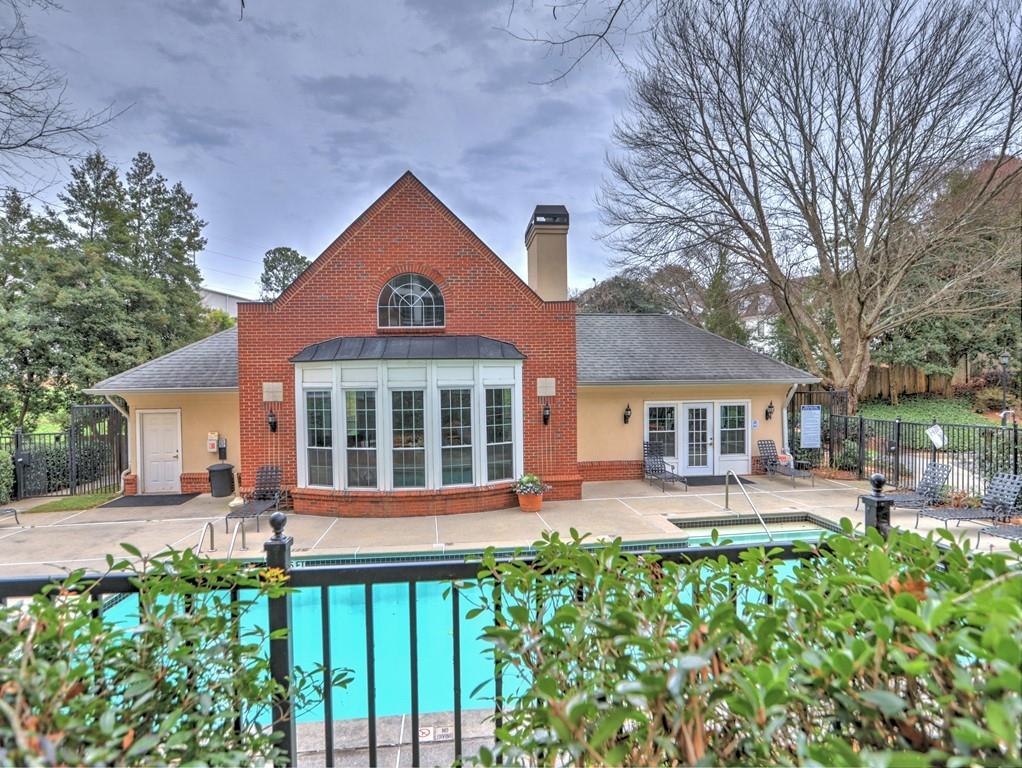 3636 Habersham Road Northwest, Unit 2308 Atlanta, GA 30305 - Photo 30 of 43 front view of a house with a yard
