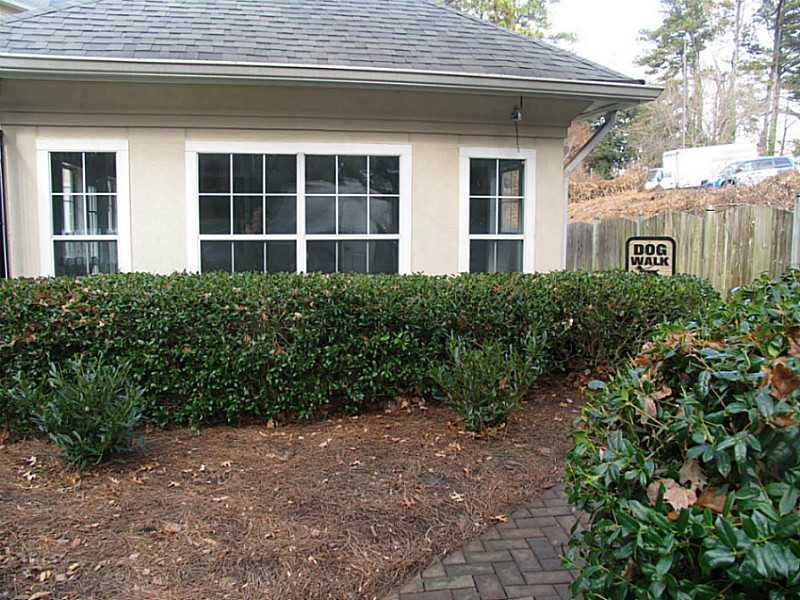 3636 Habersham Road Northwest, Unit 2308 Atlanta, GA 30305 - Photo 32 of 43 a view of a house with a yard and potted plants