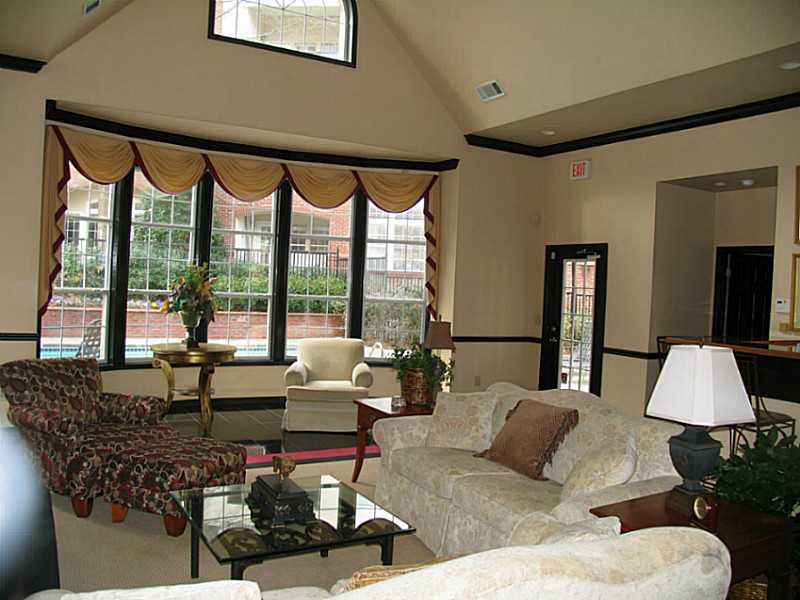 3636 Habersham Road Northwest, Unit 2308 Atlanta, GA 30305 - Photo 33 of 43 a living room with furniture and a large window