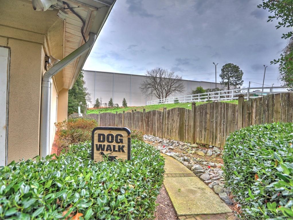3636 Habersham Road Northwest, Unit 2308 Atlanta, GA 30305 - Photo 42 of 43 a view of a lake with a house in the background