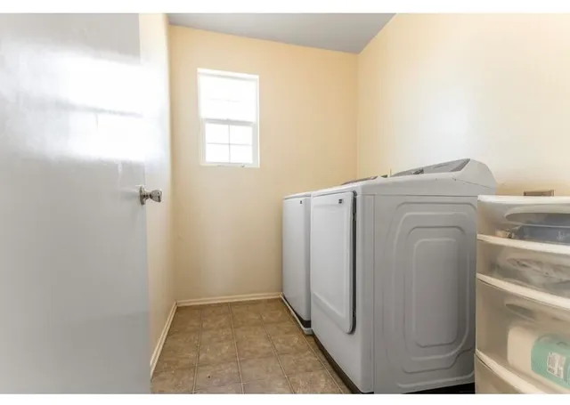 a utility room with dryer and washer