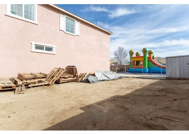 a view of a backyard of a house