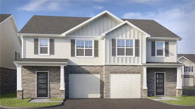 a view of a brick house with large windows