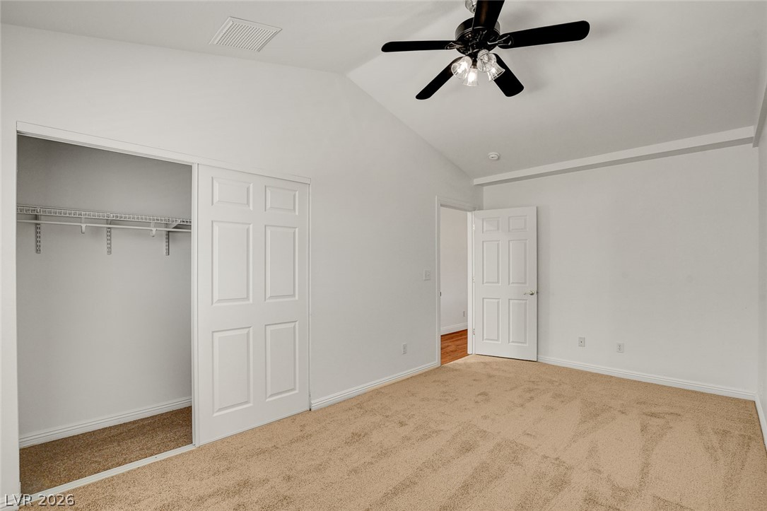 1810 Pinto Road Henderson, NV 89002 - Photo 28 of 53 A quiet bedroom with vaulted ceilings and ample closet storage.