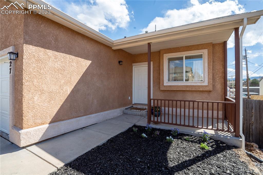 827 Circle Road Palmer Lake, CO 80133 - Photo 2 of 28 a view of a house with a wooden fence