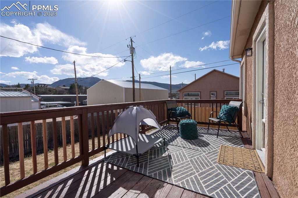 827 Circle Road Palmer Lake, CO 80133 - Photo 24 of 28 a view of a balcony with chairs