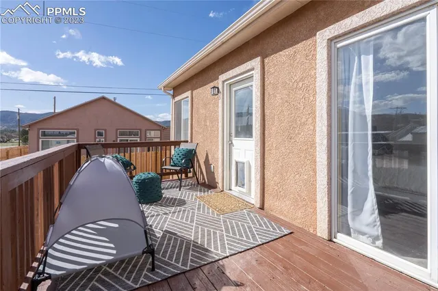 a view of a balcony with furniture