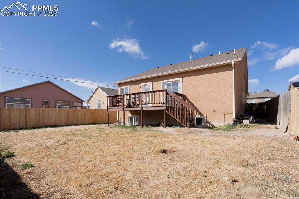 827 Circle Road Palmer Lake, CO 80133 - Photo 26 of 28 a view of a house with a snow in the yard